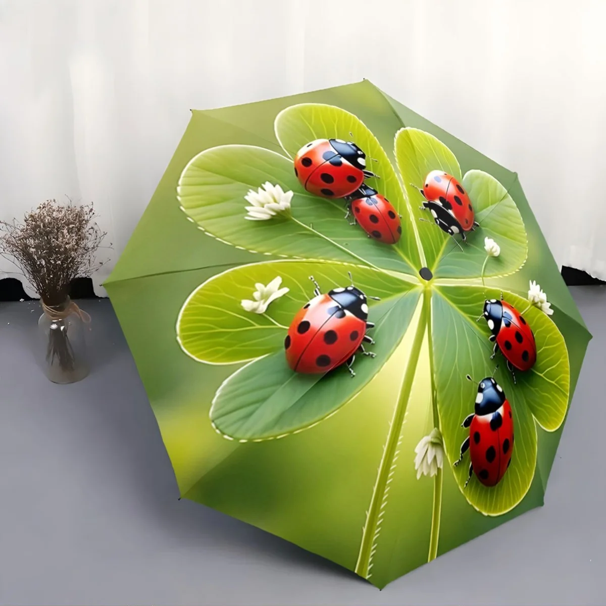 

A Compact Folding Umbrella Featuring Ladybugs on a Backdrop of Green Leaves, Perfect for Gifting on Any Occasion.