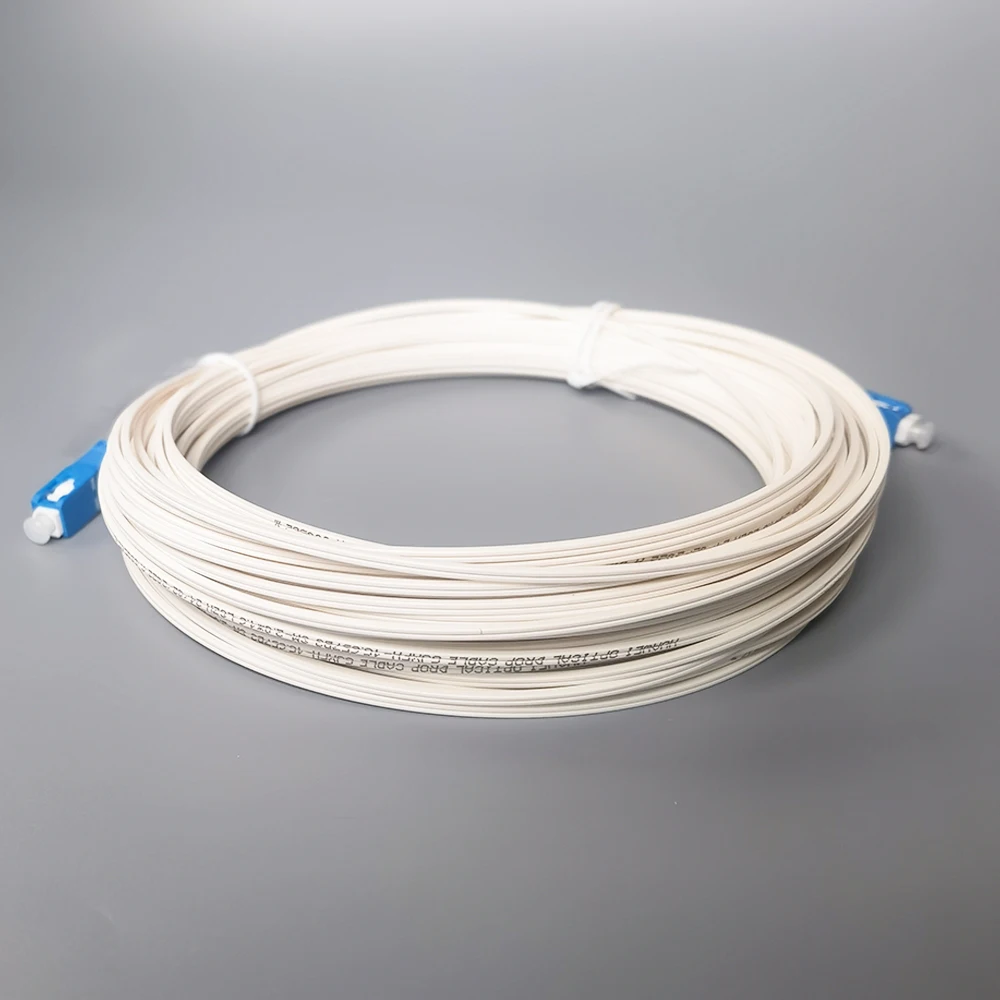 SC/UPC-SC/câble d'extension optique 20M de fibre d'UPC FTTH 2.0x1.6 GJXFH-1G657B3 le blanc LSZH de correction optique de fibre de câble de baisse