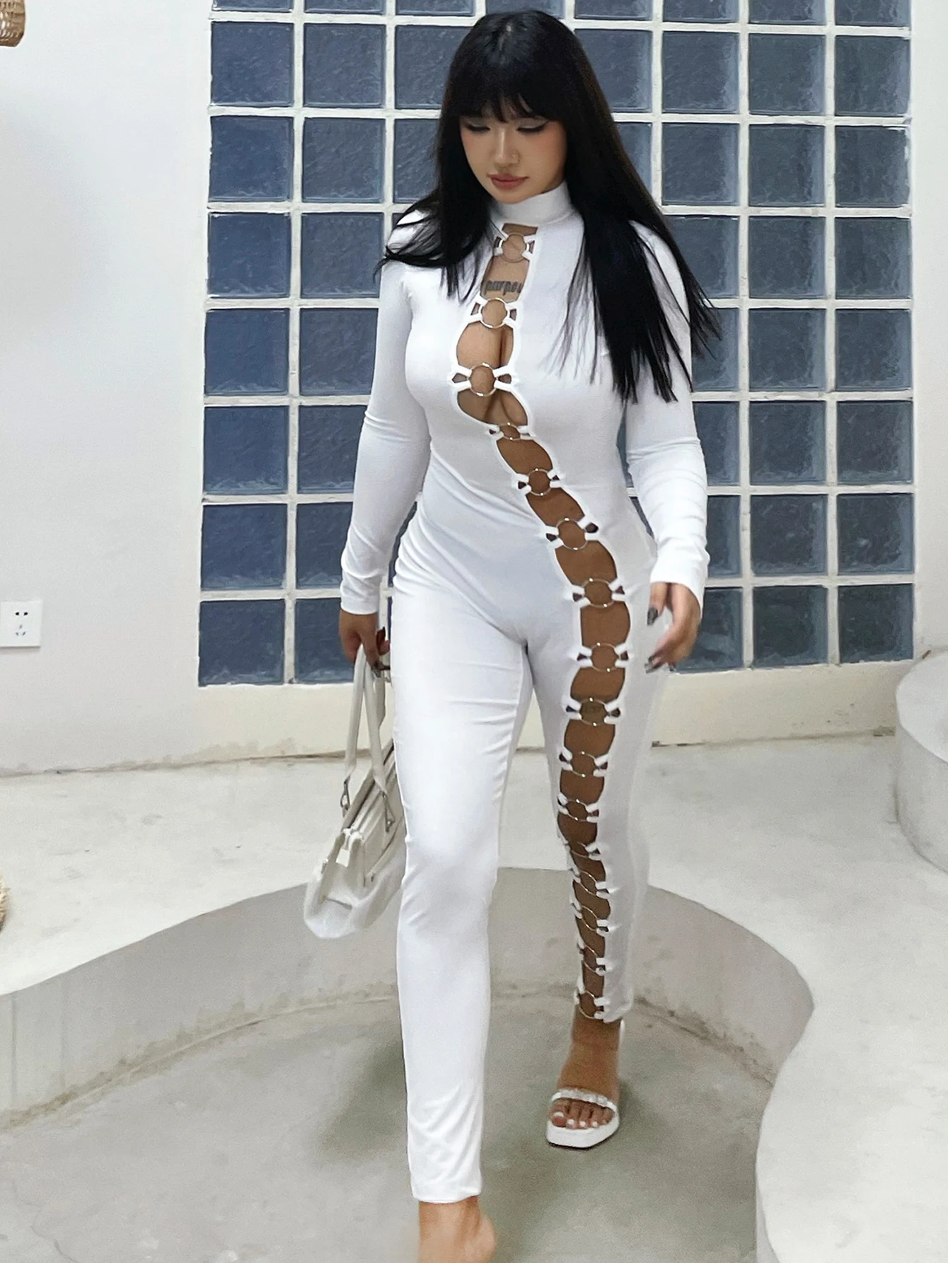 Women\'s stand up collar tight solid color jumpsuit with metal circle decoration long sleeved all-in-one pants, fitness leggings