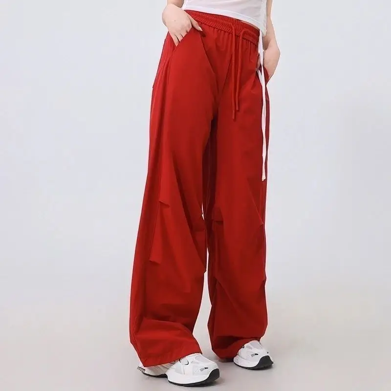 Moda stampata lettera tasche impiombate pantaloni casual abbigliamento femminile 2025 primavera estate nuovi pantaloni cargo elastici a vita alta larghi