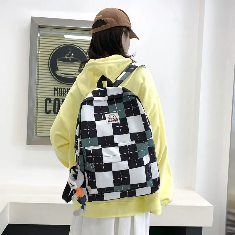 

Small niche checkerboard large capacity backpack for college students