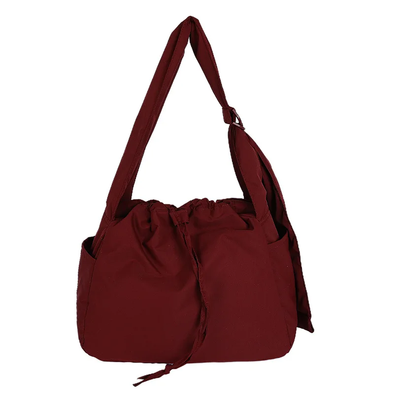 Same style as the one in the fitting room: Japanese-style couple's bags, unisex crossbody bags, outdoor drawstring shoulder bags