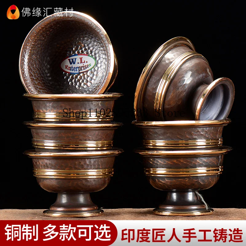 A set of Indian copper water bowls with high legs, used for offering water to Buddha7A holy water cup for offering at the Buddh