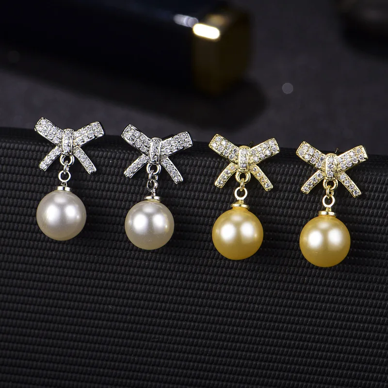 Korean-style realistic imitation natural freshwater pearl with full diamonds and bow-shaped earrings for sensitive ears - women'
