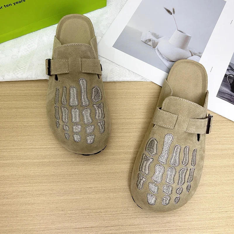 

2025 bone embroidered flat shoes fashionable women's slippers new niche design casual and comfortable wearing with toe caps