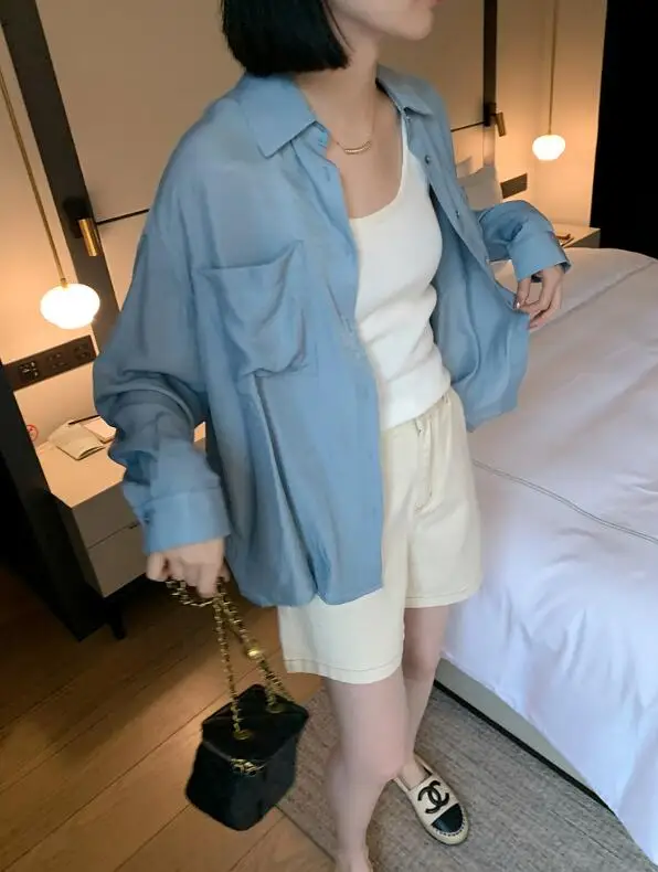 

Spring and summer women's casual solid color lapel long sleeved pocket decoration loose shirt