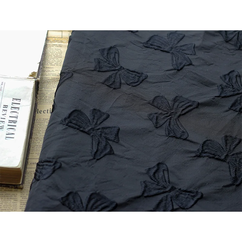 Yarn Dyed Embossed Black Bow Jacquard Fabric Stiff Polyester Autumn and Winter Jacquard Dress Fabric 45cmx140cm