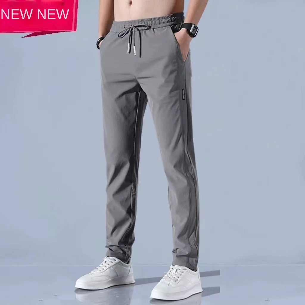 

Summer ice silk quick drying casual pants for men, ultra-thin four sided elastic loose and versatile trendy sports pants for men