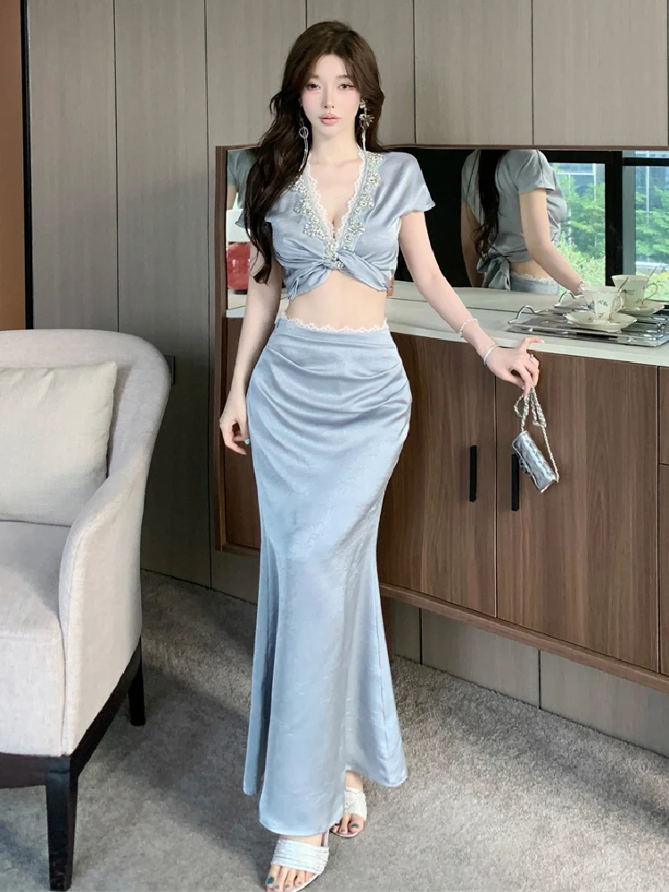 

Heavy industry diamond studded high-end twisted V-neck sexy temperament top fish tail half length long skirt two-piece set