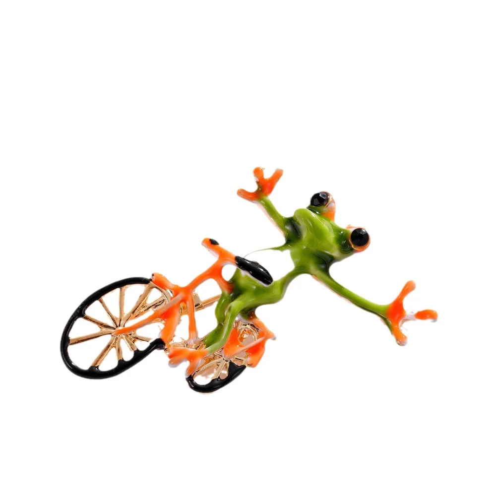 New Creative Funny Frog Riding Bike Brooches For Women Man Trendy Enamel Animal Brooch Pins Suit Coat Accessories Jewelry Gifts