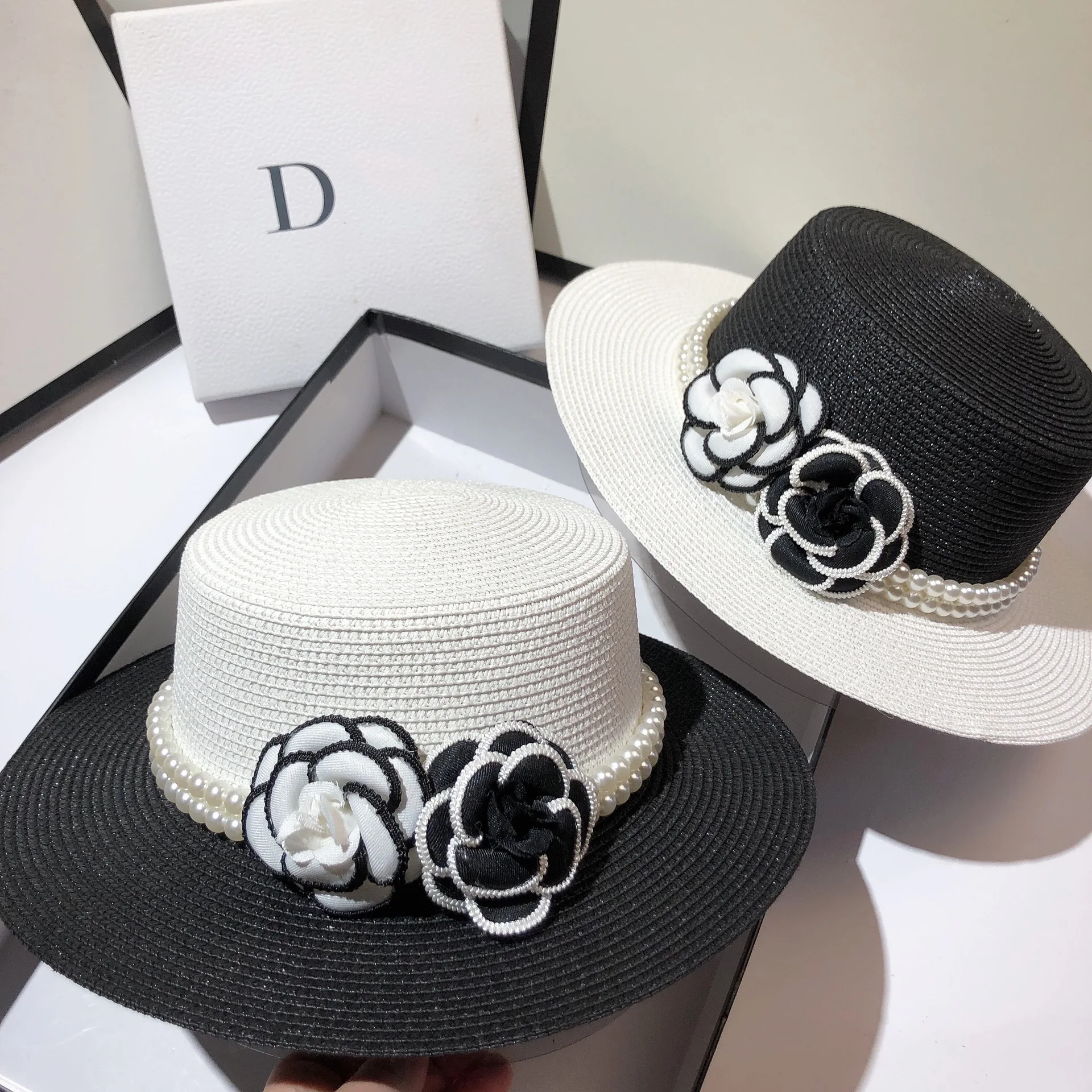 Designer French Paris fashion show small fragrant flower flat hat summer light luxury fine grass woven sunscreen sun hat women