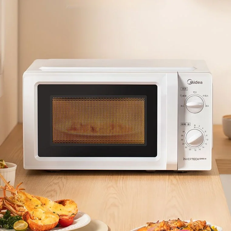 Il forno a microonde domestico Midea è un giradischi meccanico leggero e a cinque velocità che riscalda uniformemente il forno a microonde portatile