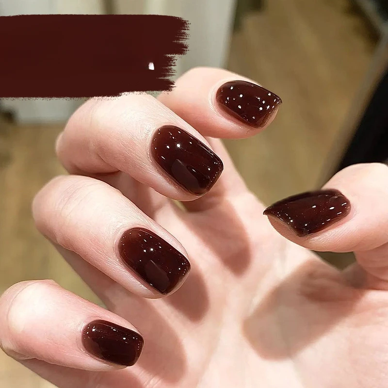 

Black tea brown wearing nail handmade manicure advanced sense solid color showing hands white autumn and winter nail patch