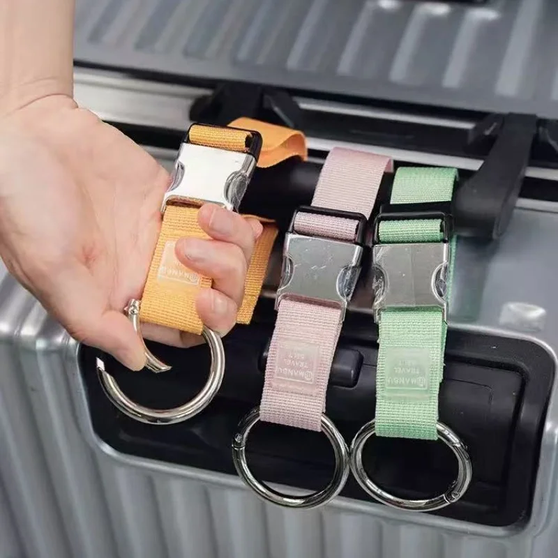 

1pc Essential small items for traveling, such as external luggage hooks, backpack hooks, and snap-on lanyards