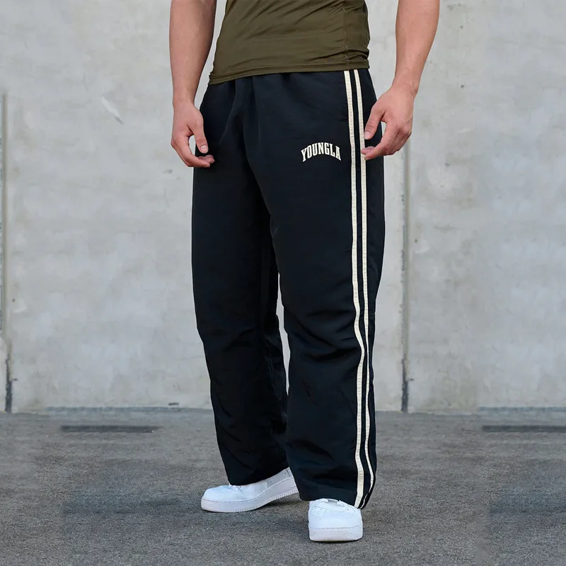 Pantaloni sportivi da giovane uomo pantaloni Casual stampati con giunture a doppia striscia palestra Fitness pantaloni a gamba dritta a vita media