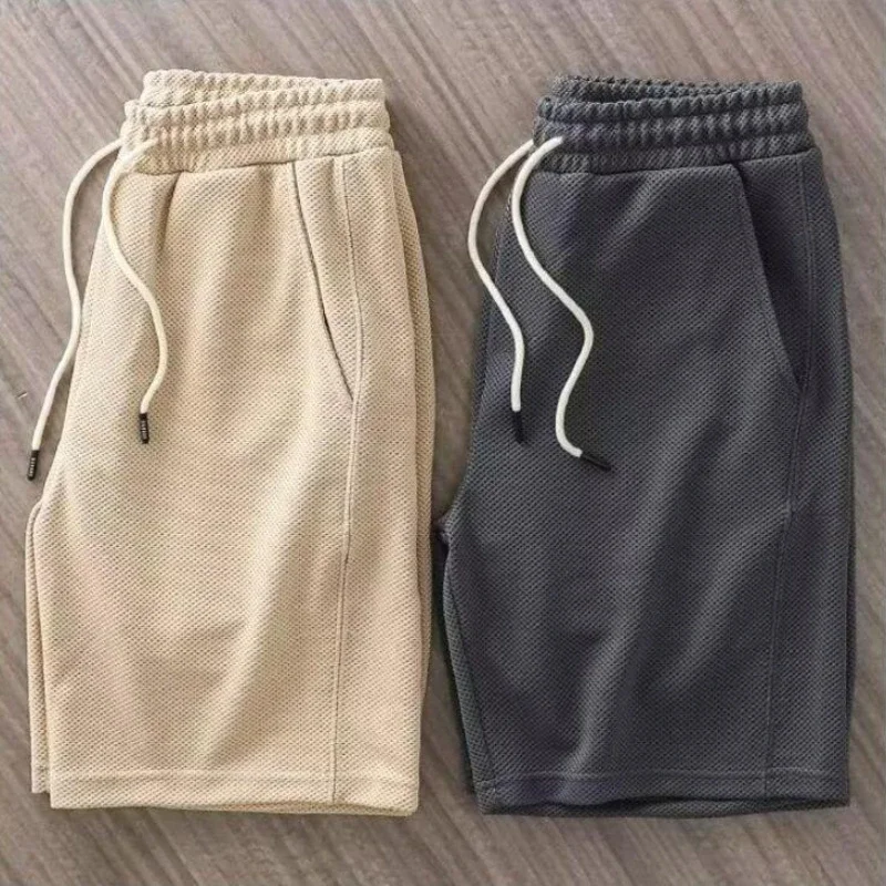 Pantaloncini solidi da uomo stringati larghi estivi traspiranti casual larghi sportivi al ginocchio stile giapponese Harajuku bodybuilding alla moda