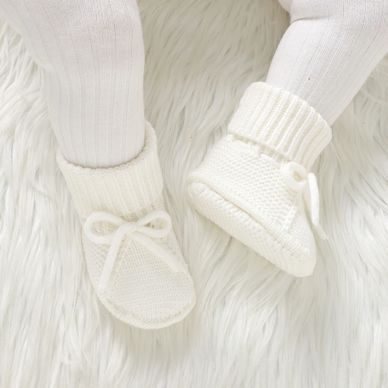 أحذية مشوا لأول مرة للفتيات الصغيرات من عمر 0 إلى 18 شهرًا نعل ناعم متماسك لحديثي الولادة بعقدة على شكل فيونكة لمرحلة ما قبل المشي أحذية كروشيه للأطفال الصغار غير قابلة للانزلاق