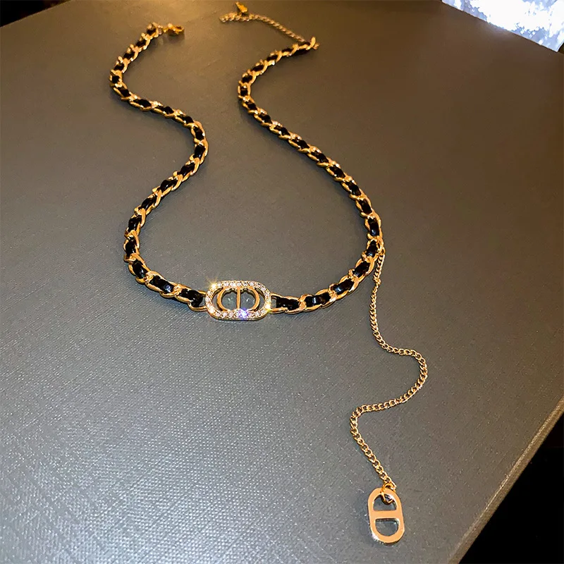 

Gilt nose leather wrapped necklace with diamonds