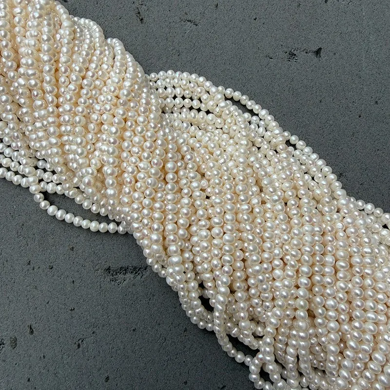 A string of 4-5mm nucleus-free potato-shaped freshwater pearls for DIY handcraft, approximately 36cm long with about 78 beads.