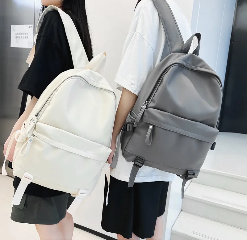 Mochila de piel sintética para hombre y mujer, bolso de viaje de gran capacidad, diseño clásico, color blanco y negro