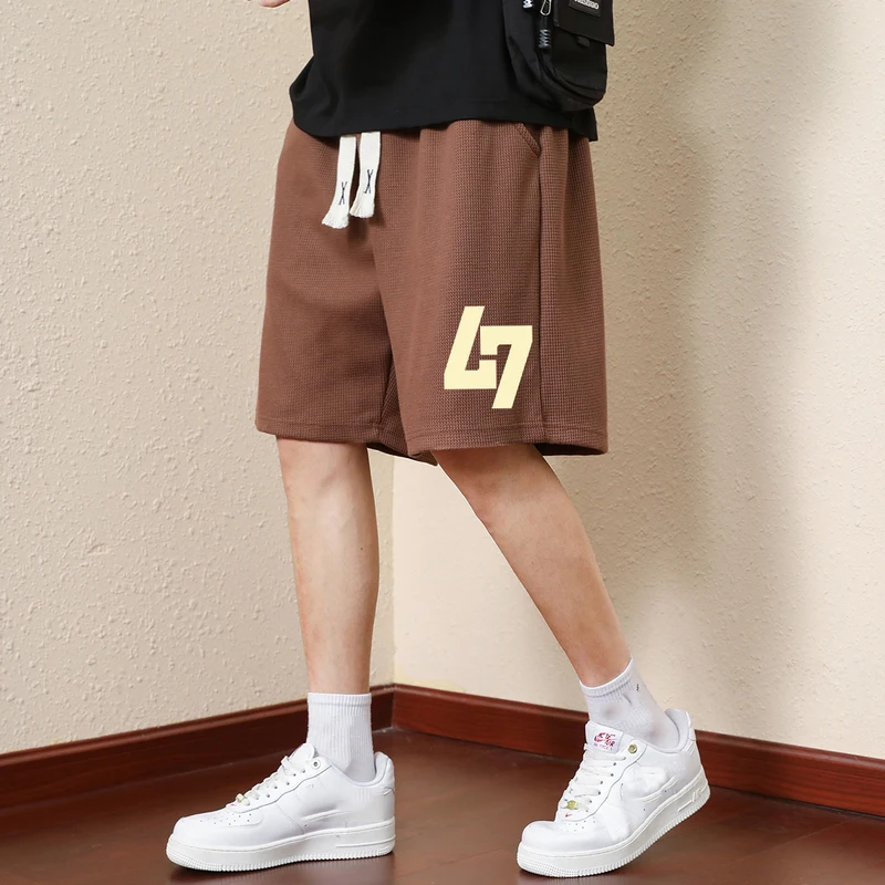 

TRAF Men's Casual Shorts with Eye-Catching Monogram Print and Drawstring Waistband.