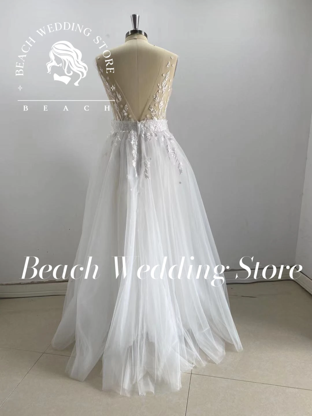 ชายหาดที่กําหนดเองชุดแต่งงานดอกไม้ผู้หญิง A-Line ลึก V คอ Applique แขนกุด Backless Tulle ความยาวชั้นคุณภาพสูงเซ็กซี่