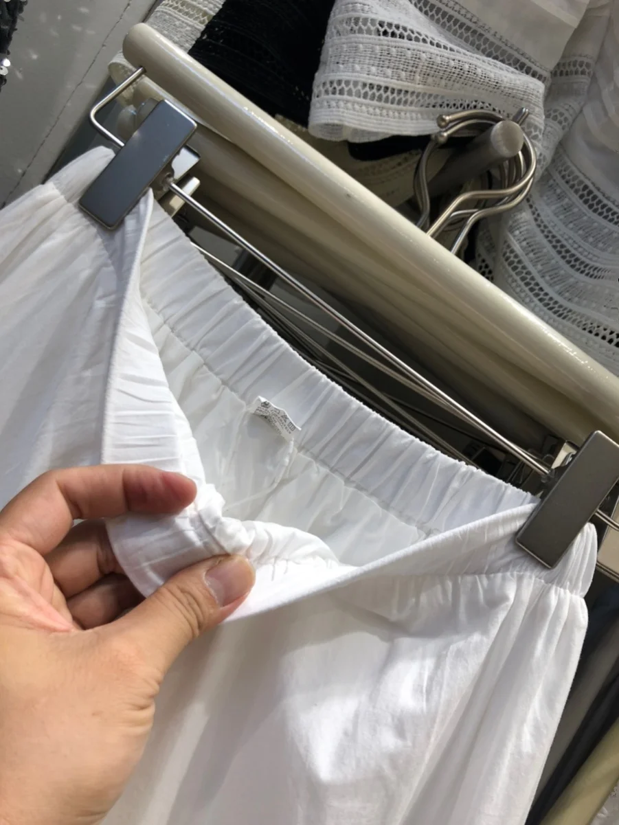 กระโปรงทรงเอเอวสูงปักลายฉลุสีขาวสไตล์เค้กอบสำหรับผู้หญิง กระโปรงมิดิทรงเอ สไตล์หวานๆ สำหรับฤดูใบไม้ผลิ