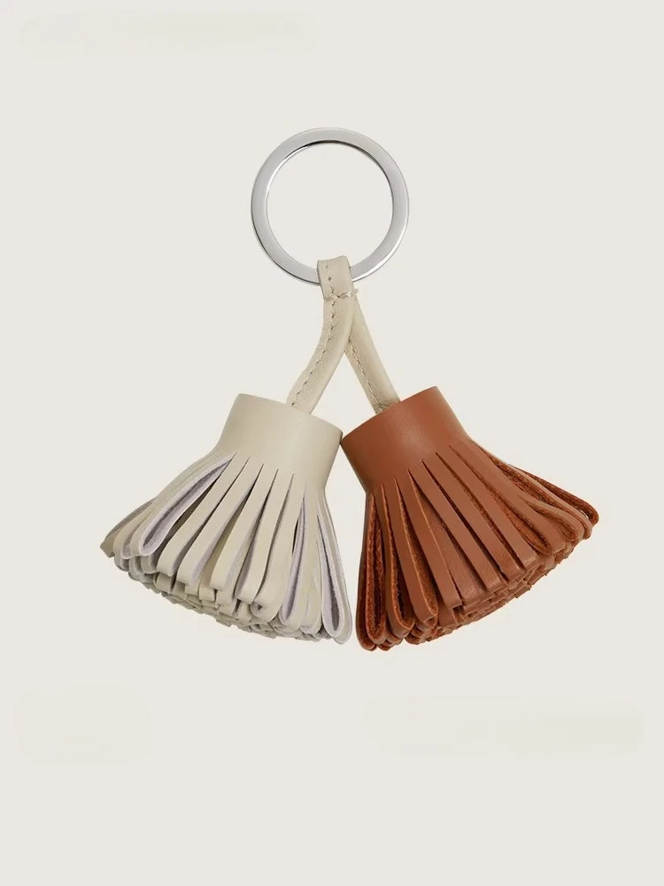 

2026 Premium Handmade Leather Tassel Bag Charm Luxury Keychain Car Ornament for Women Bag Accessory