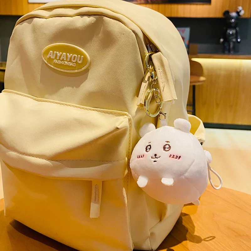 Chiikawa japonés de dibujos animados de peluche Xiaoba Usac colgante creatividad Jiikawa llavero Linda muñeca coche colgante tapones para los oídos tapa Accesorios