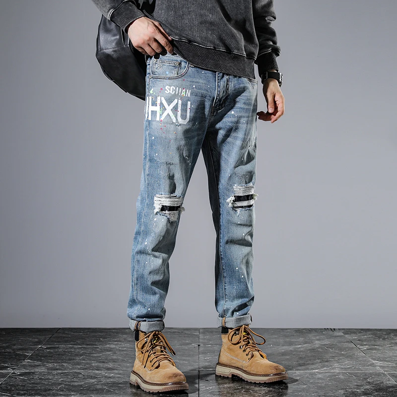 

High-end personalised biker ripped patch patch men's jeans vintage washed ins light blue printed spray-painted trousers