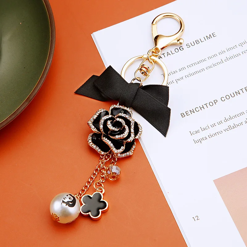 الأزياء القوس عالية Guishan الشاي زهرة سيارة المفاتيح حقيبة قلادة اللؤلؤ هدية صغيرة التبعي