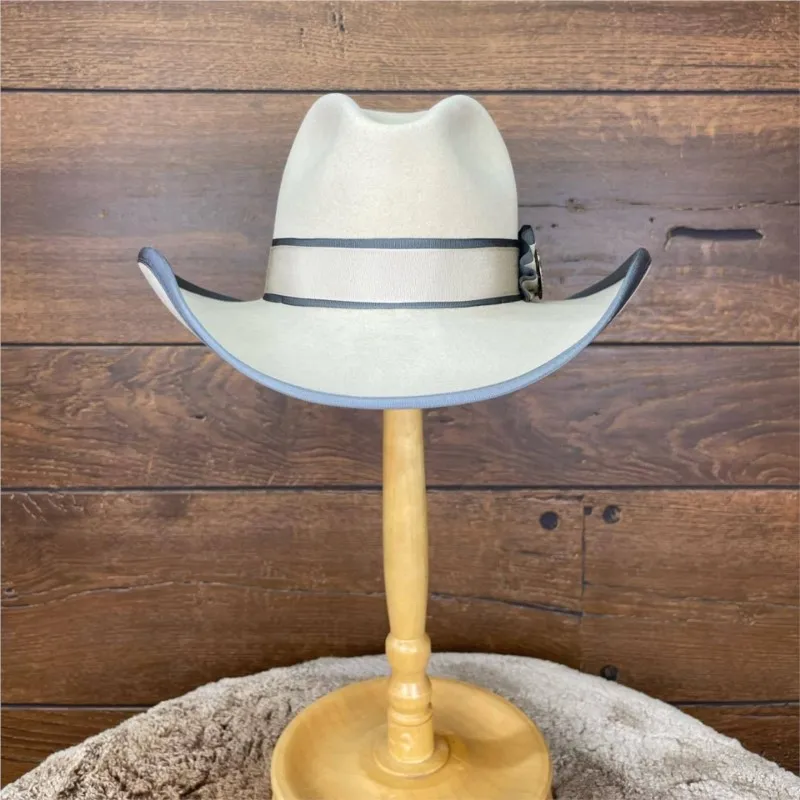 A white felt top hat with contrasting color ribbon metal label and wide-brimmed