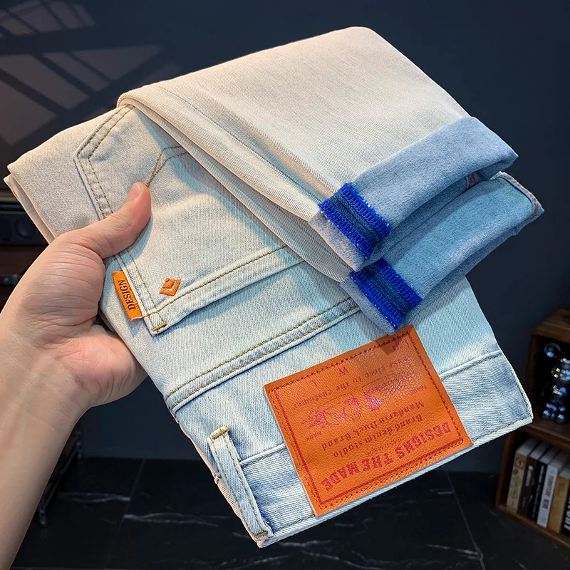 Jeans pria musim panas tipis slim fit kurus kasual serbaguna gaya Korea sedikit longgar lembut putih celana panjang