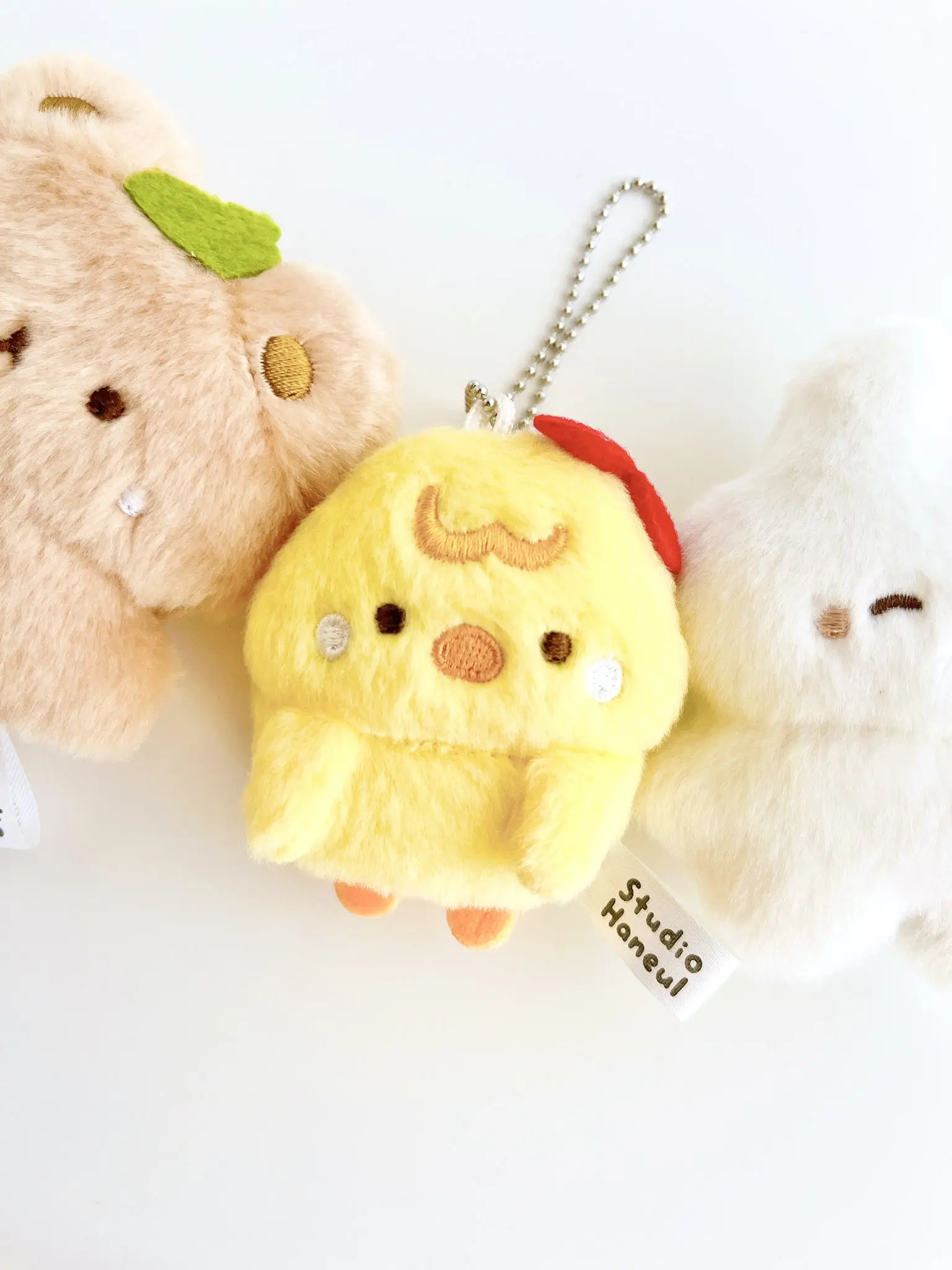 En Stock Qualia juguetes de peluche lindo Pam y tarta juguete de peluche esponjoso 3 ojos redondos oso conejo sonrisa conejito pollito BC figuras colgantes