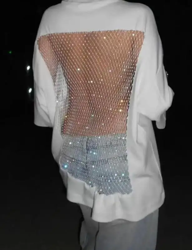 Camiseta feminina 2026 primavera moda nova sexy rede de pesca perspectiva oco design solto cor sólida camiseta adequada para festas