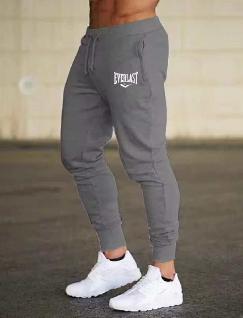 السراويل الجديدة المطبوعة الخريف EVERLAST الرجال/النساء تشغيل السراويل ركض Sweatpant الرياضة بناطيل كاجوال اللياقة البدنية الصالة الرياضية تنفس السراويل