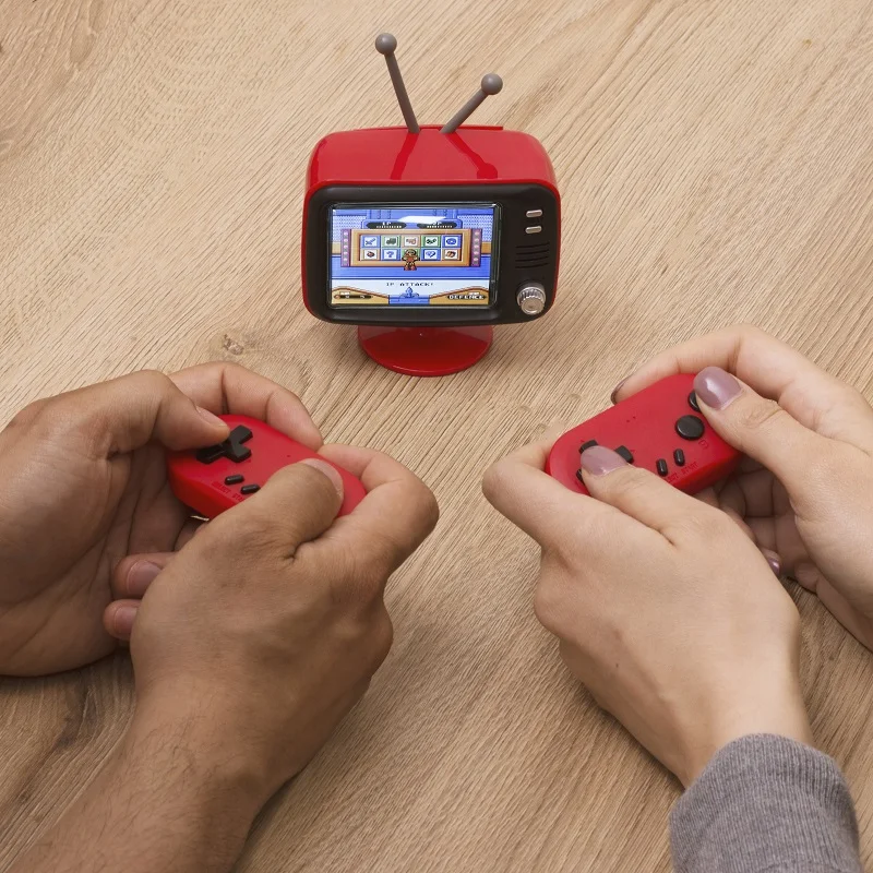 A two player game console with a retro mini TV design