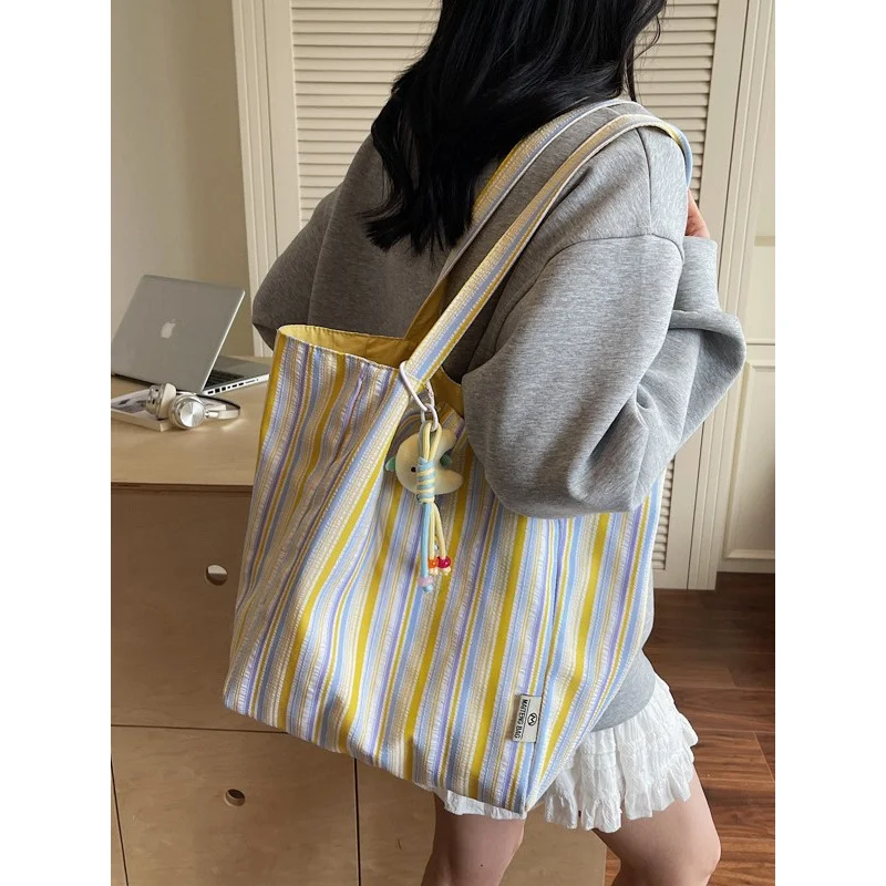 

Striped canvas shoulder bag for female college students attending classes2025New Summer Simple Versatile Large Capacity Tote Bag