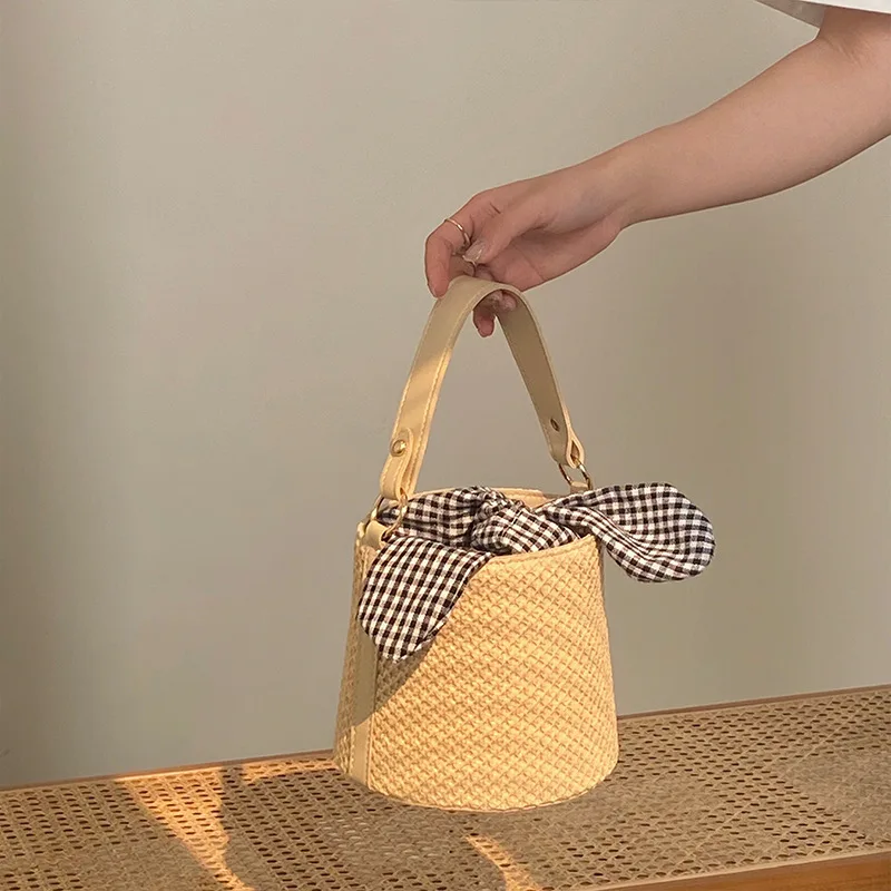 

2025 Summer New Straw Woven Eco Bag for Women Fashionable Personalized Knotted Handbag Sweet Holiday Crossbody Bucket Bag