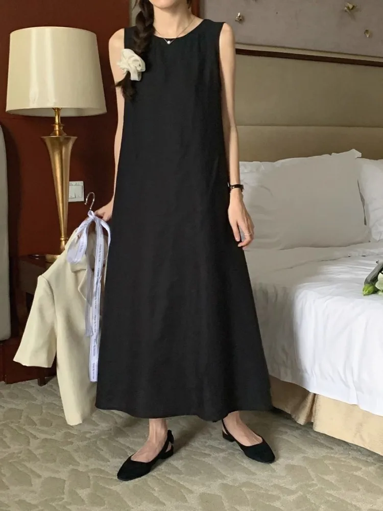Abiti longuette senza maniche Donna Solid Scava fuori Backless Design temperamento vintage Casual Chic Vestito estivo allentato Abiti femminili