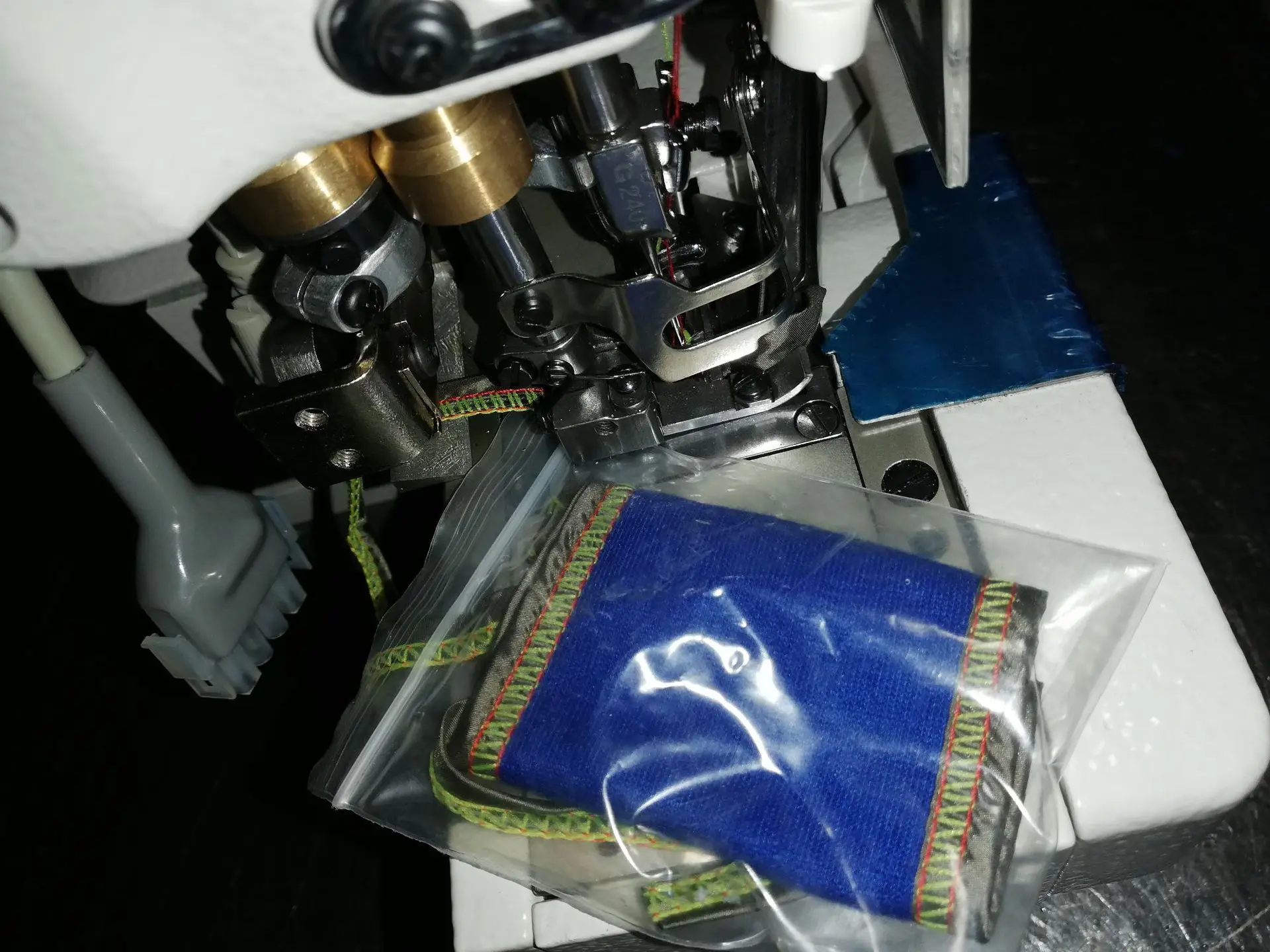Upper roller interlock sewing machine, bumper car, upper sewing machine with piping edge
