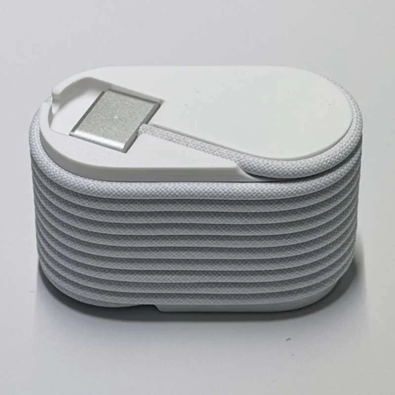 Organizador portátil para guardar cables, con sistema de enrollado automático, diseño compacto, ideal para el cable de carga MagSafe 3 de Macbook, para usar en el escritorio o de viaje.