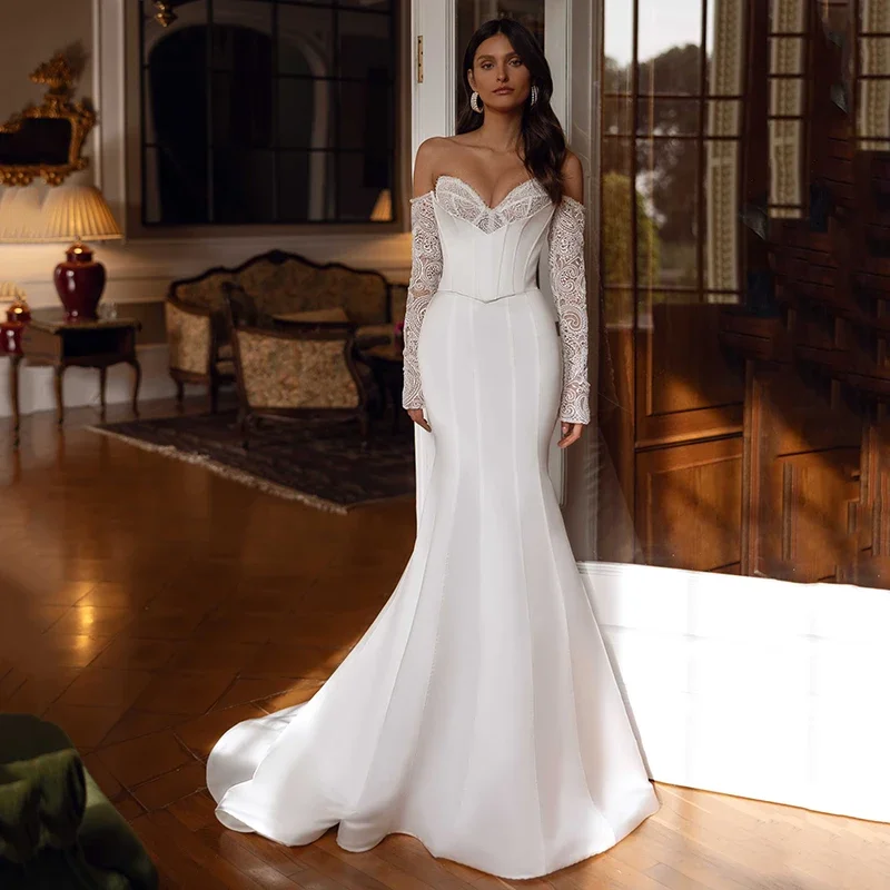 فستان زفاف حورية البحر مثير بدون حمالات على شكل قلب من الدانتيل بأكمام طويلة فستان زفاف بوهيمي للشاطئ فستان زفاف على شكل كرة حسب الطلب