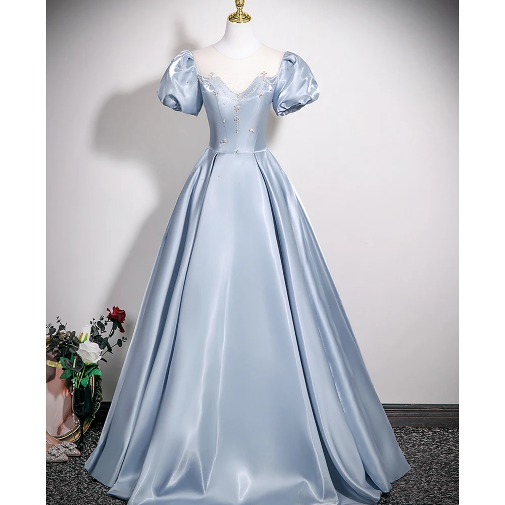 

Elegant Light Blue Satin Prom Gown with Puff Sleeves and Crystal Detailing