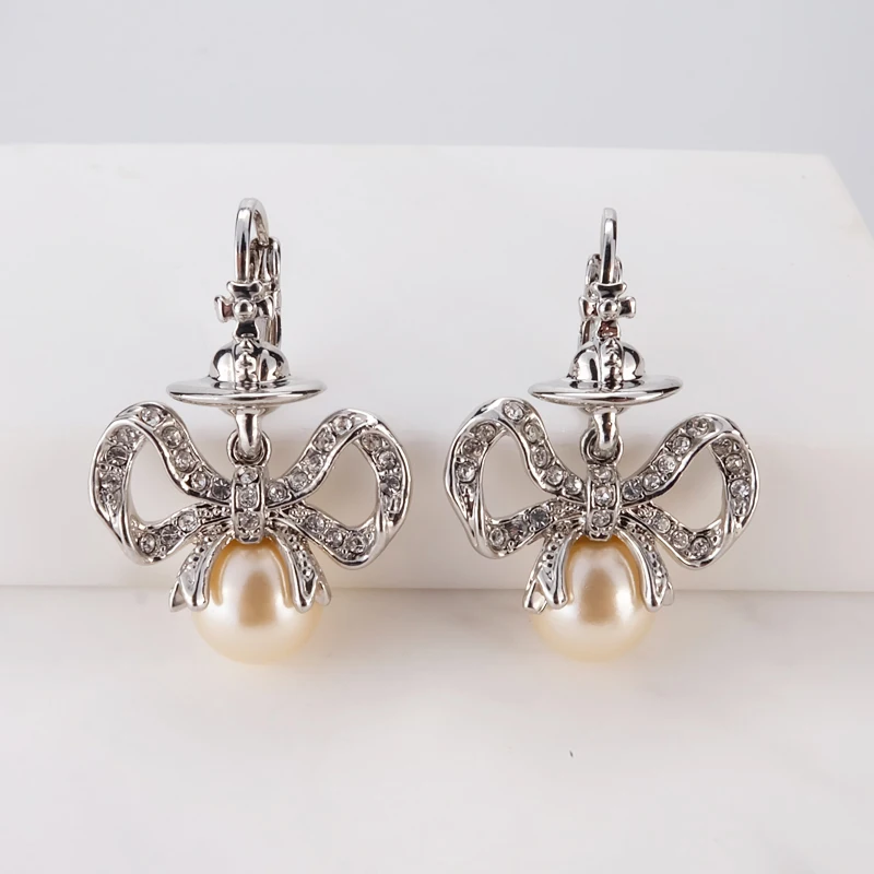 

Серьги из стерлингового серебра S925 с простым романтичным дизайном, милым бантиком и маленькими подвесками в форме капель воды и Сатурна.