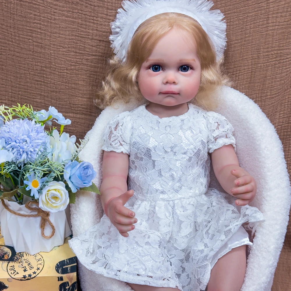 ตุ๊กตาไวนิลรีบอร์นขนาด 22 นิ้ว - ตุ๊กตาหายากสำหรับนักสะสม ผมบลอนด์ ตาสีฟ้า ชุดเจ้าหญิงสีขาว ตุ๊กตาเหมือนจริงที่สามารถจัดท่าทางได้ บรรจุในกล่องของขวัญ
