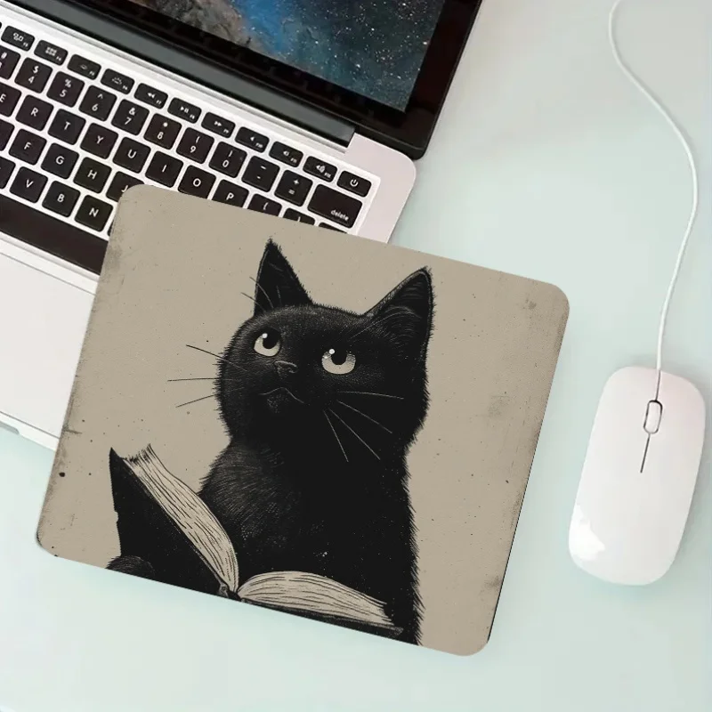 

Black cat reading design pattern mouse pad with a rubber base and anti-slip desk pad is suitable for both office and home use