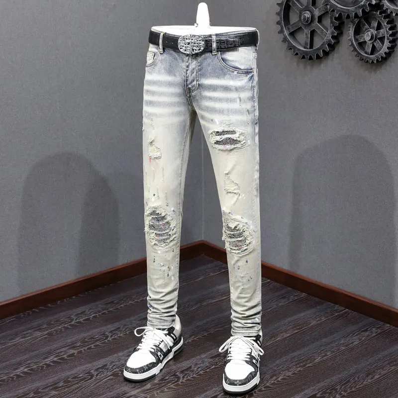 

Fashionable new men's jeans with pleats, perforations, patches, elastic slim fit, washed with water, nostalgic light blue jeans,