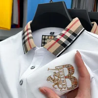 Polo de manga corta de marca de lujo para hombre camiseta informal con solapa bordada a cuadros a la moda de alta gama top de algodón transpirable