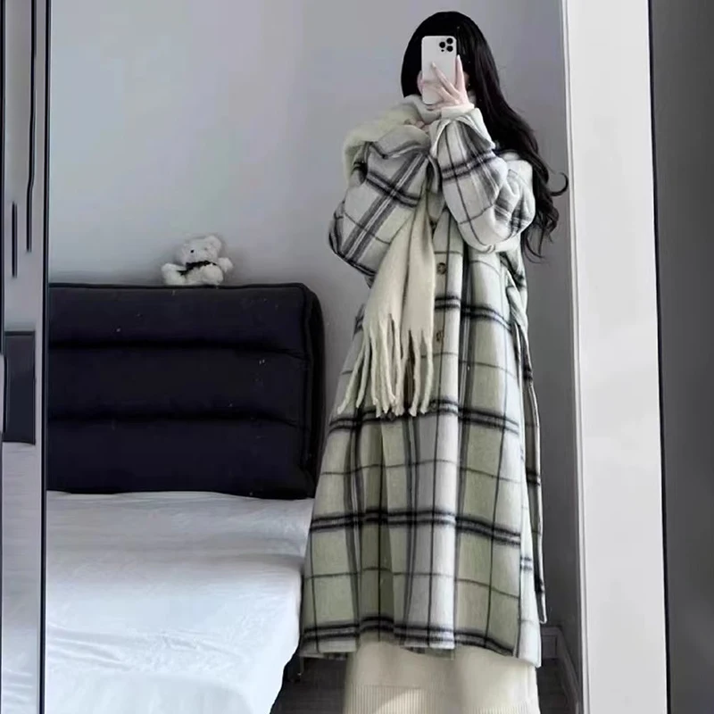 Giacca a vento in lana scozzese chic Cappotto da donna 2026 Autunno Inverno Nuovo trench lungo in lana allentato con cintura coreana